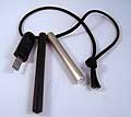 The complete fire making set includes a FireSteel.com FireSteel, Super Scraper, and Magnesium Tinder Rod - all held together with a lanyard made from genuine 550-parachute cord