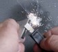 Scrape the FireSteel toward the pile of magnesium shavings you have created - which will catch on fire and burn at thousands of degrees F, helping you to start a fire even with damp wood.